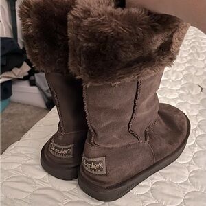 Suede slip on boots with faux fur lining.